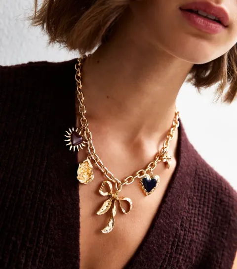 Gold Tone Statement Bow Charm Necklace