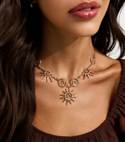 Gold Tone Large Swirly Sun Necklace