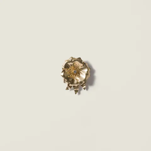 Metal brooch with crystal