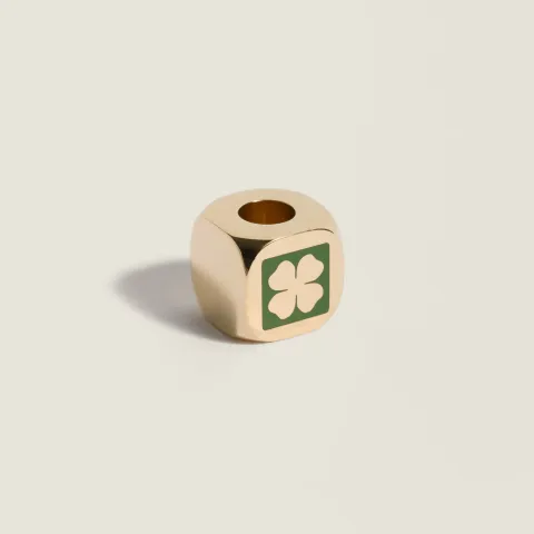 Enameled metal dice charm with four-leaf clover
