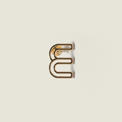 Metal logo brooch