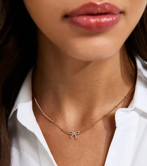 Gold Tone Diamante Bow Necklace