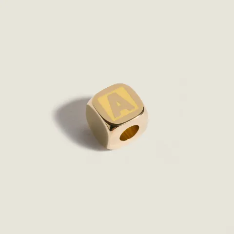 Enameled metal dice charm