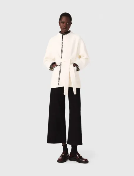 Lined coat with contrasting ribbon