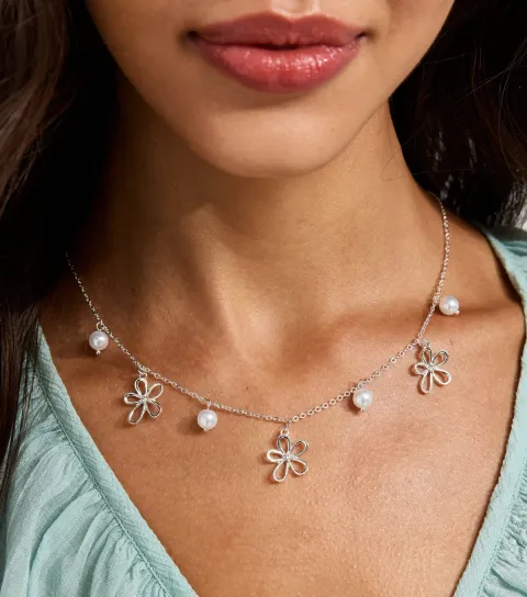 Silver Tone Cutout Flower Charm Necklace