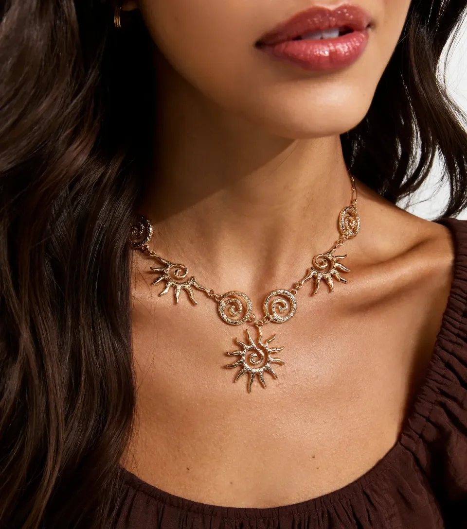 Gold Tone Large Swirly Sun Necklace