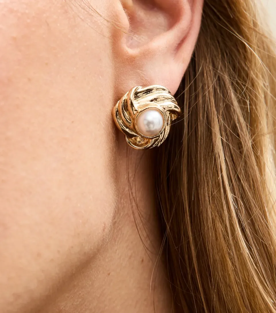Gold Tone Ribbed Faux Pearl Knot Earrings.