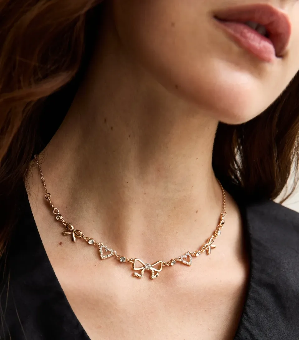 Gold Tone Diamante Heart and Bow Necklace