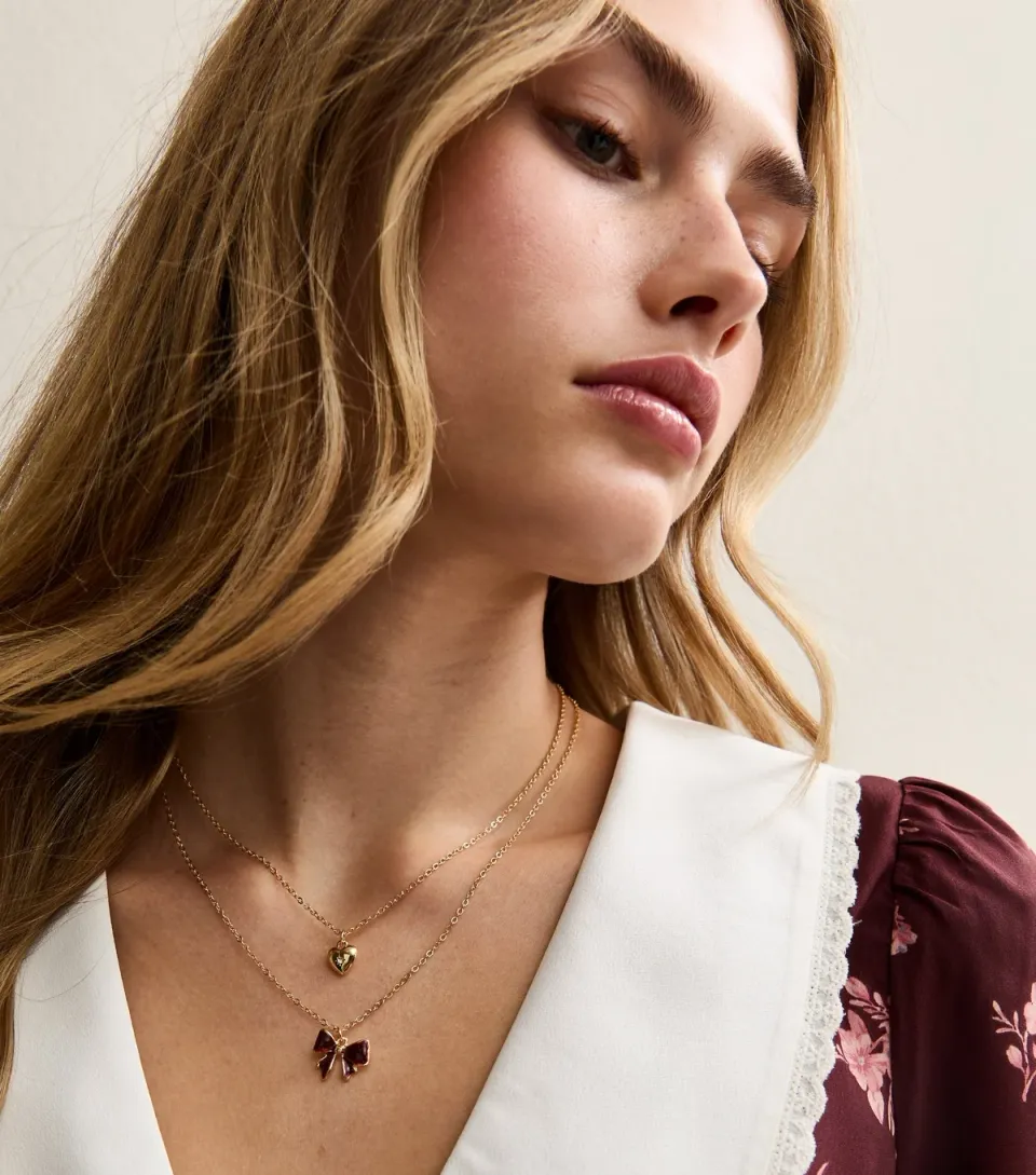 Gold Tone Double Layer Bow and Heart Pendant Necklace