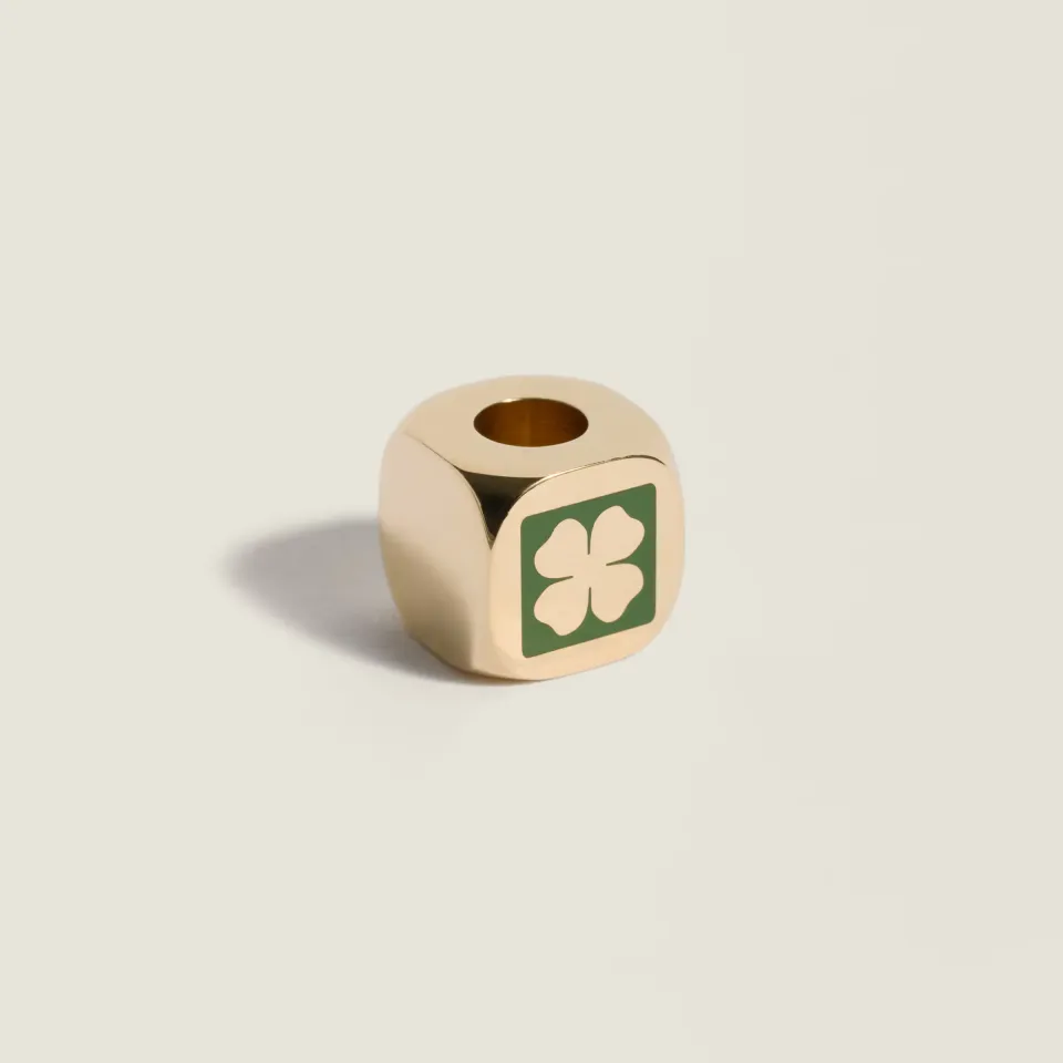 Enameled metal dice charm with four-leaf clover