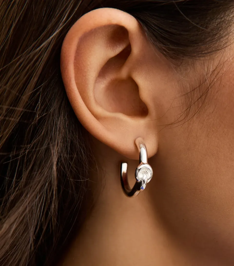 Silver Tone Knot Small Hoop Earrings