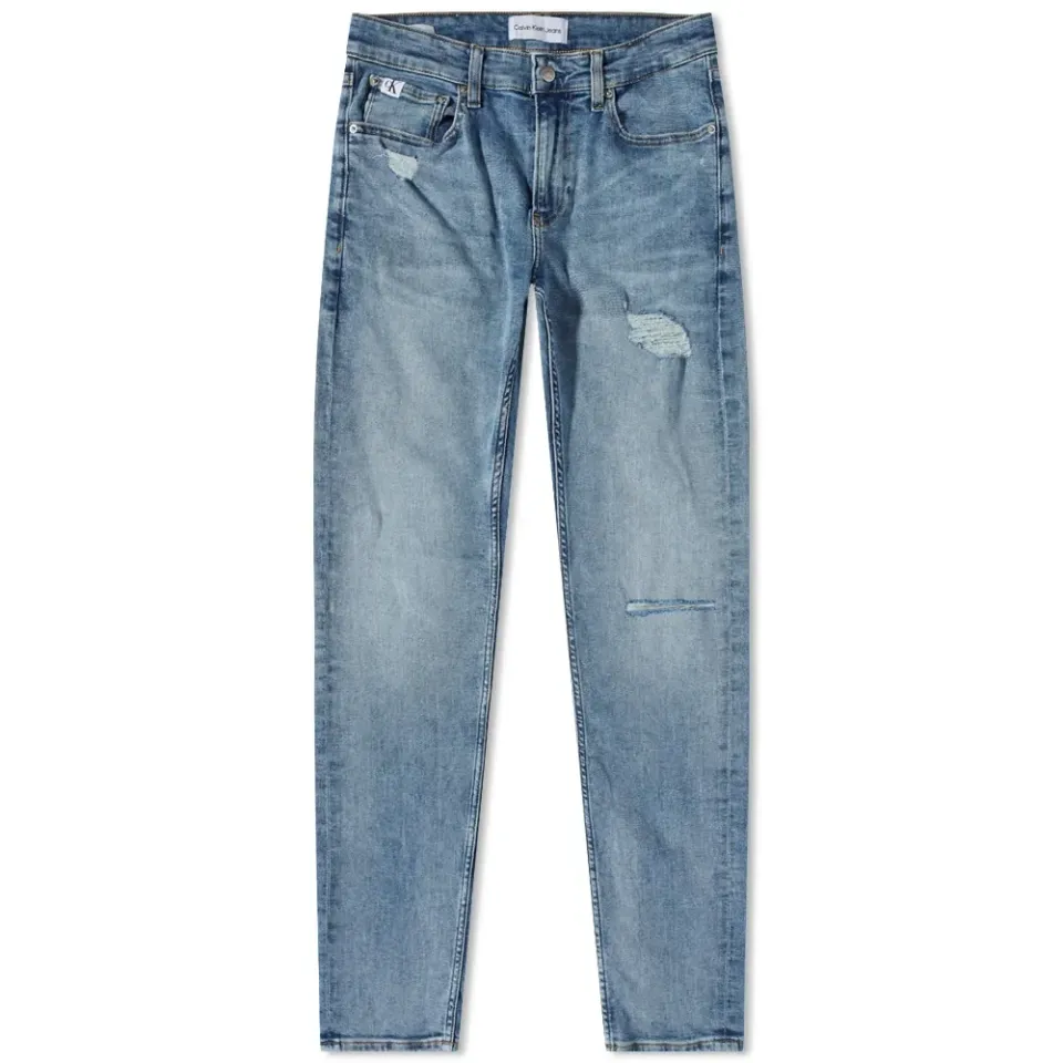 Distressed Medium Wash Slim Taper Jeans
