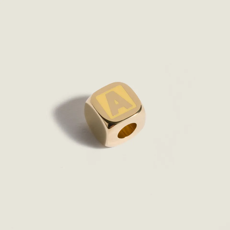 Enameled metal dice charm